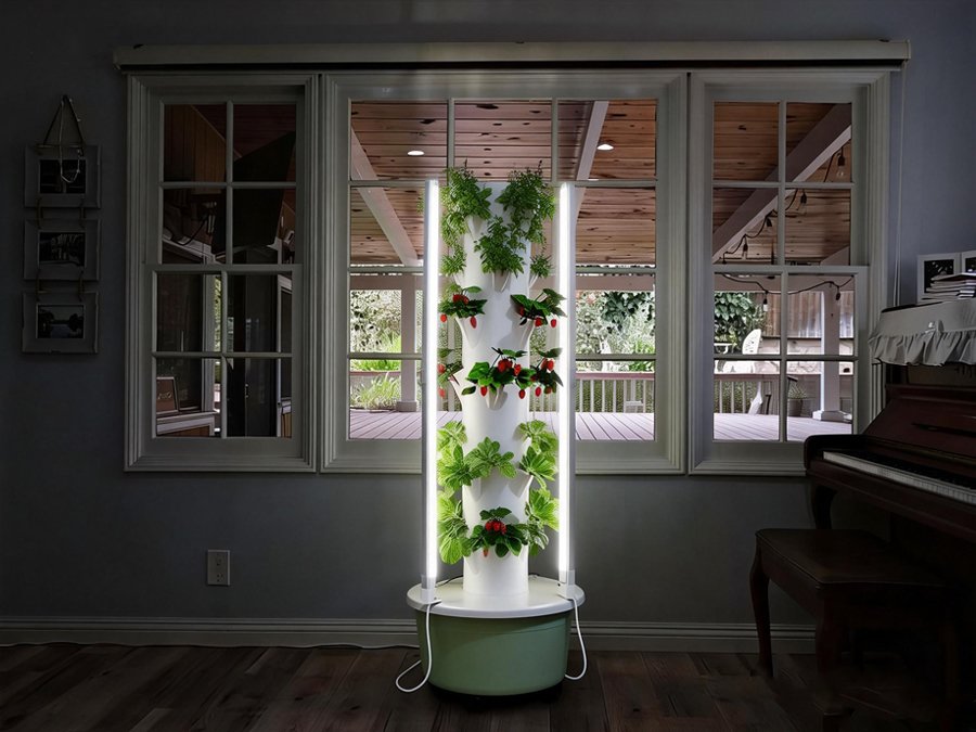 Indoor vertical hydroponic tower with LED grow lights, growing lettuce and cherry tomatoes in a living room, showcasing space-efficient, pesticide-free home gardening